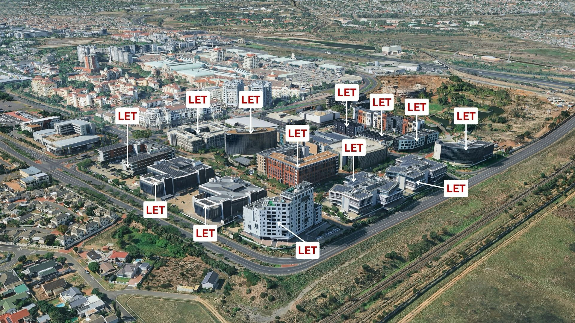 Aerial view of Century City showing multiple prime office buildings marked as LET